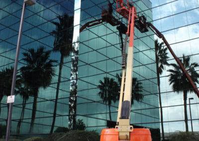 The Dutch Touch team cleaning the windows of a high-rise building in Southern California