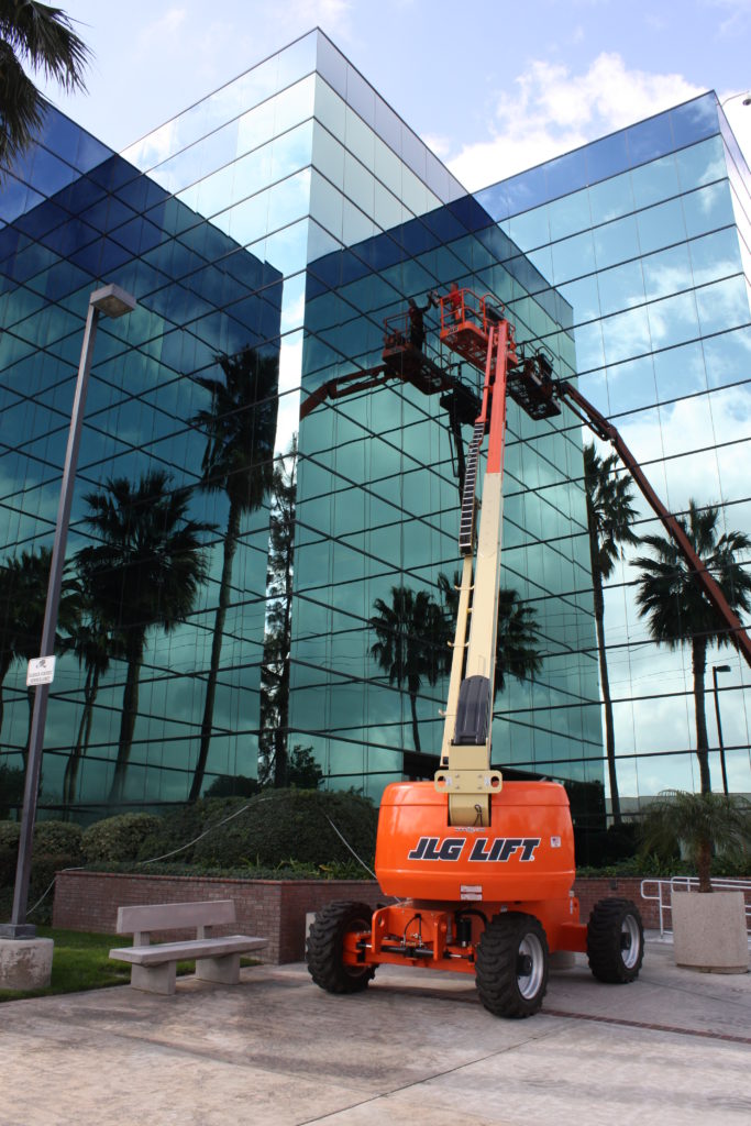 The Dutch Touch team cleaning the windows of a high-rise building in Southern California