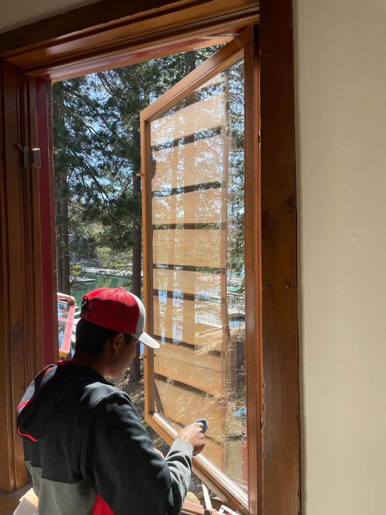 Cleaning the windows of a home in Southern California